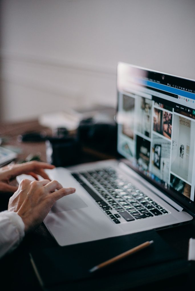 Person browsing a website on a laptop, the kind of visit a session recording replays